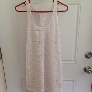 White bathing suit cover up.